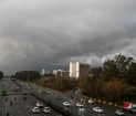 Commuters drive along a road as dark clouds are pictured over the skies of Islamabad /file photo
